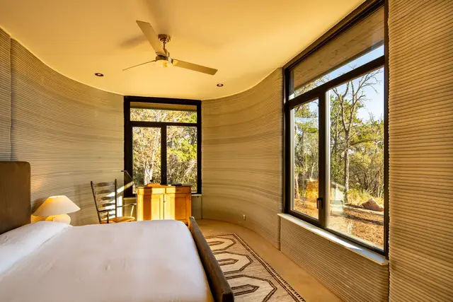 Bedroom with curved printed walls