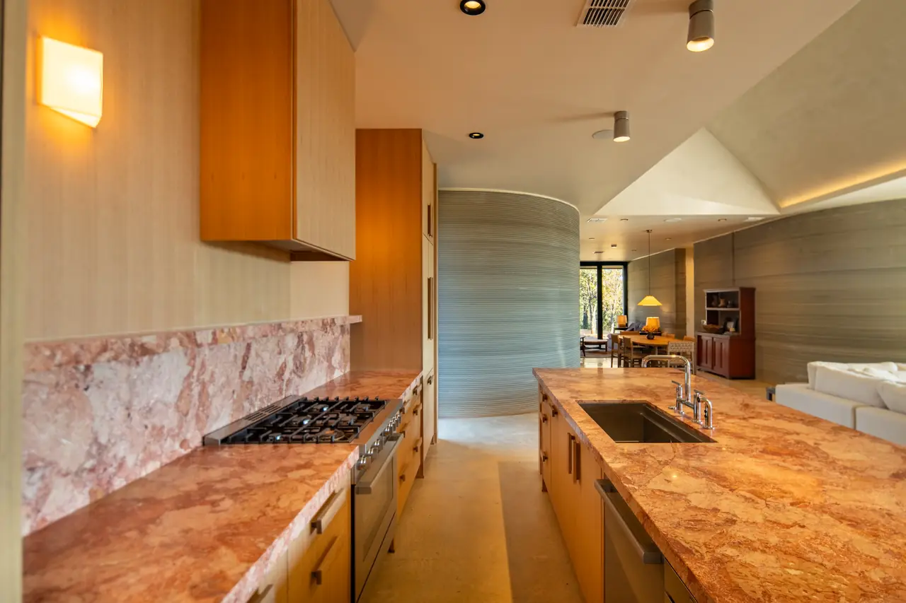 Chef's kitchen with marble counters