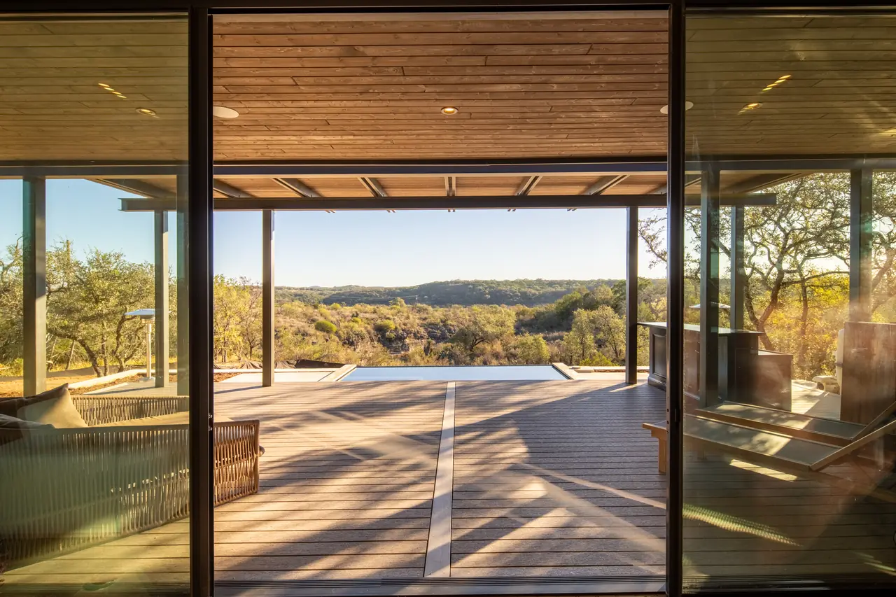 Covered deck and pool at golden hour