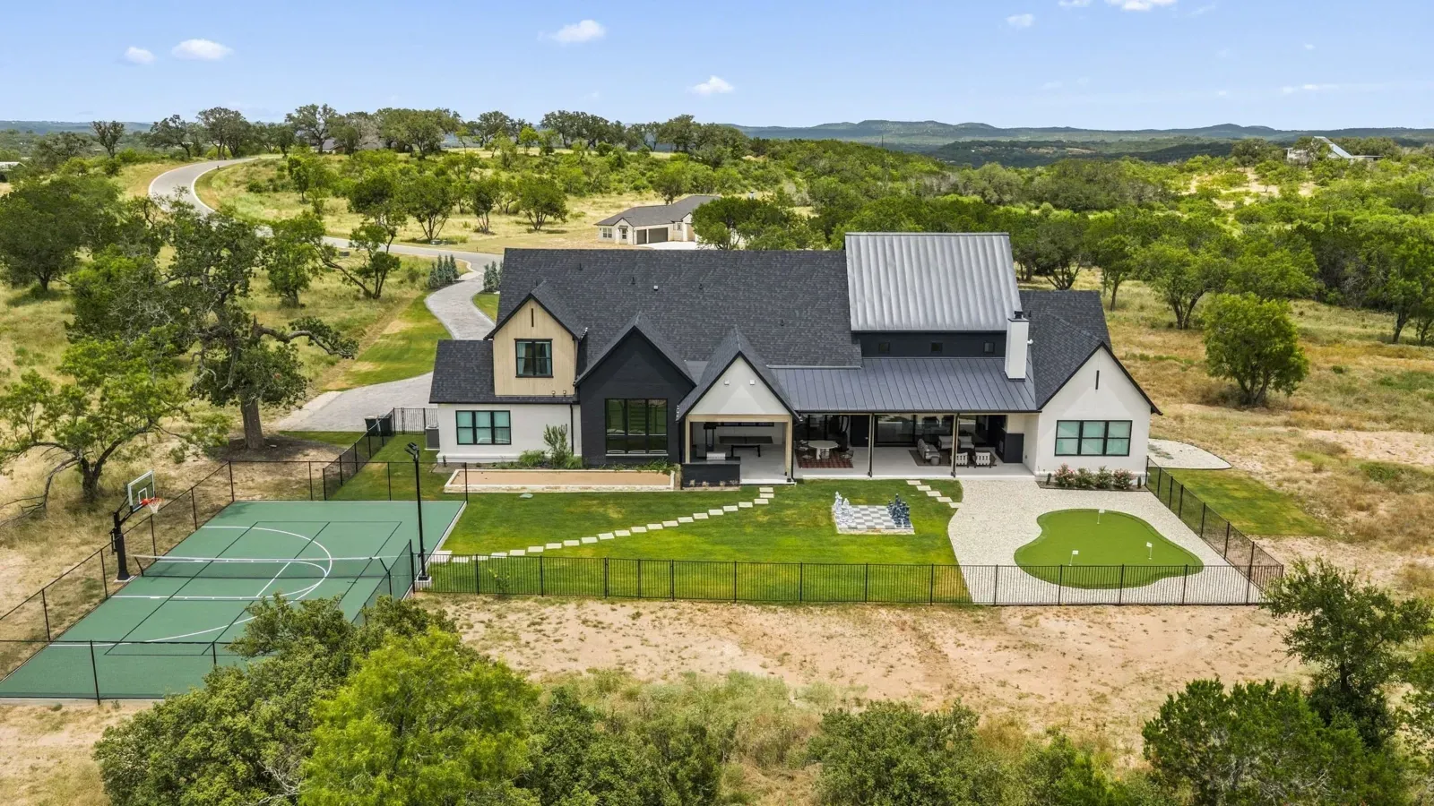 Canyon House from above, with its pickleball court and lawn