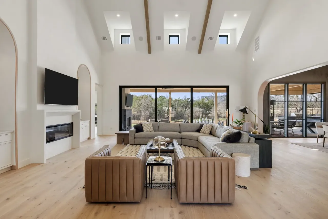 Living room with a long sectional and a fireplace