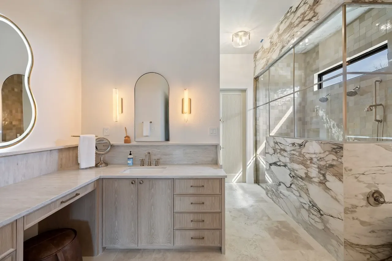 Primary bathroom with a marble shower
