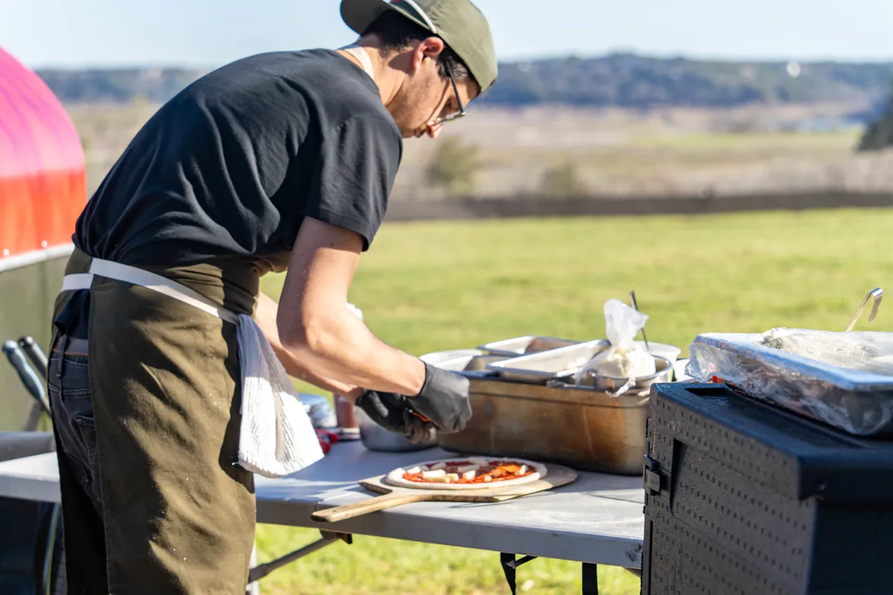 Wood-fired pizza on the clubhouse lawn