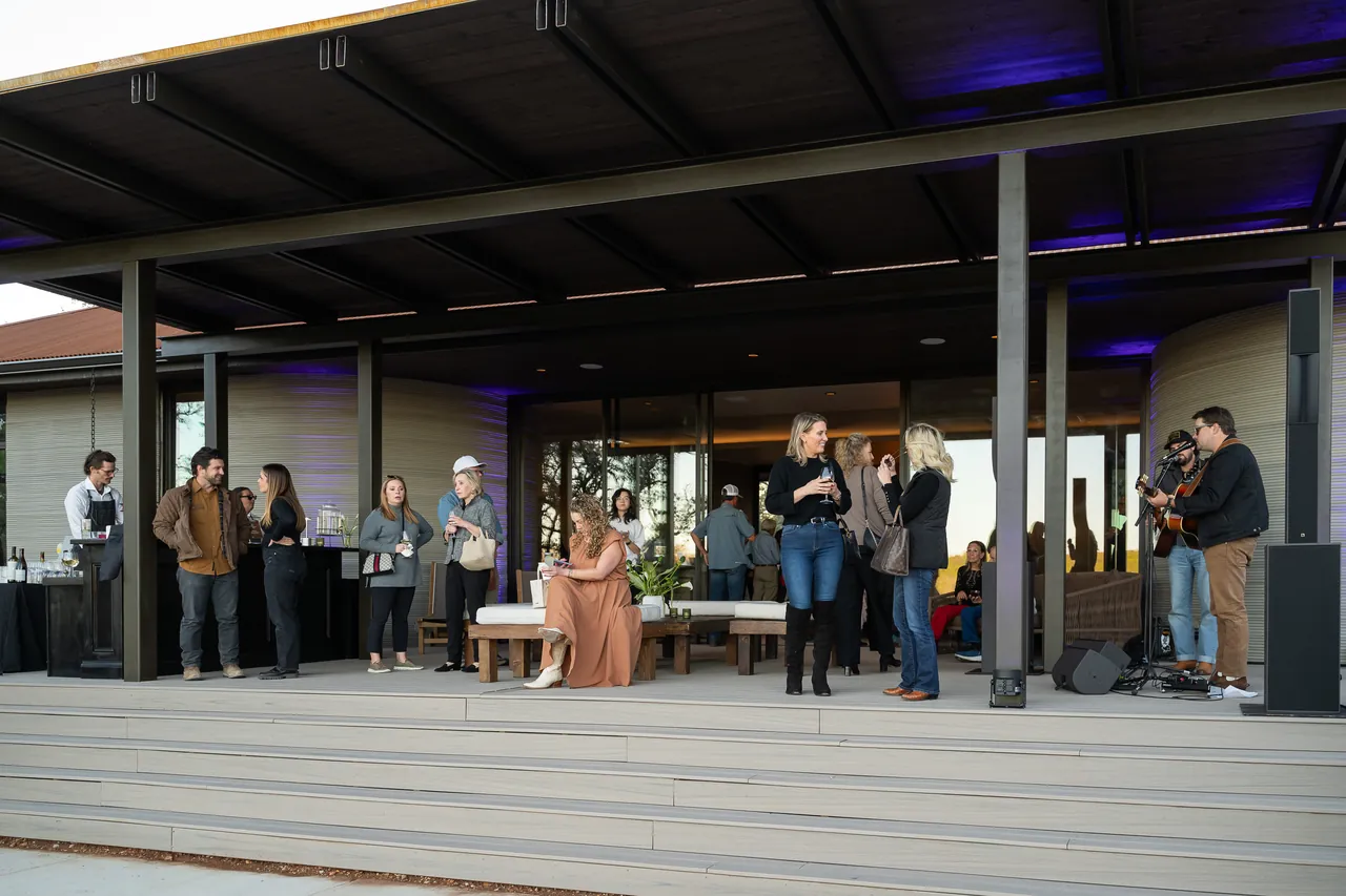 Guests on Aura's deck at the October 2025 unveiling
