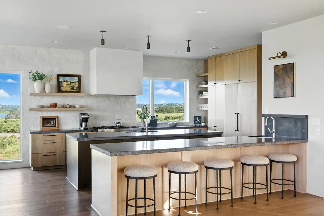 Kitchen with a long island and bar seating