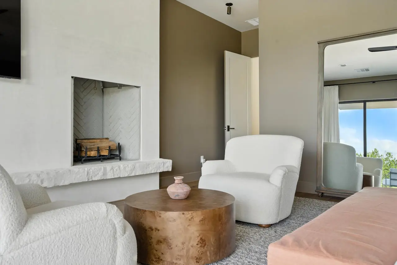 Sitting room with a fireplace and lake view