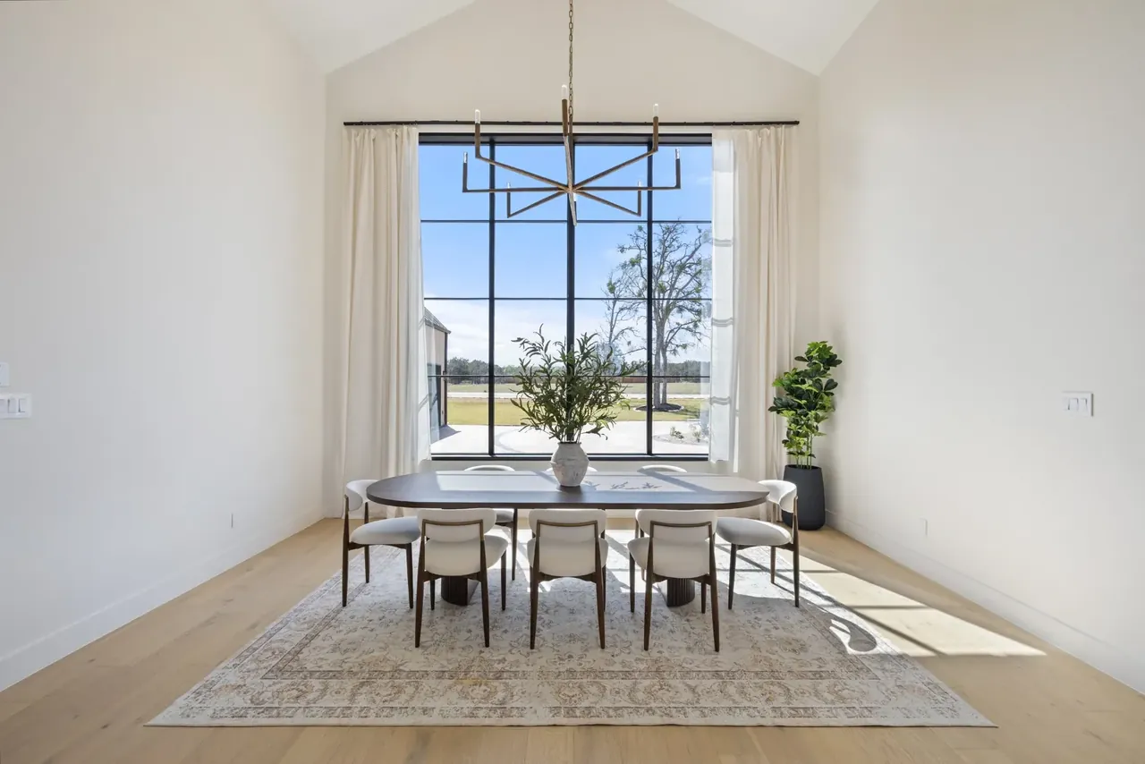 Dining table for ten under a tall window