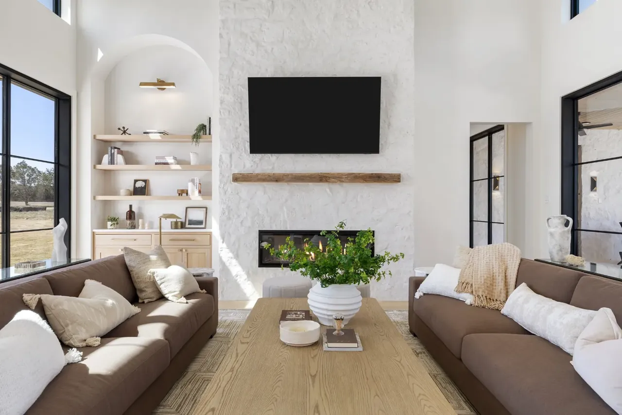 Living room with a fireplace and built-in shelves