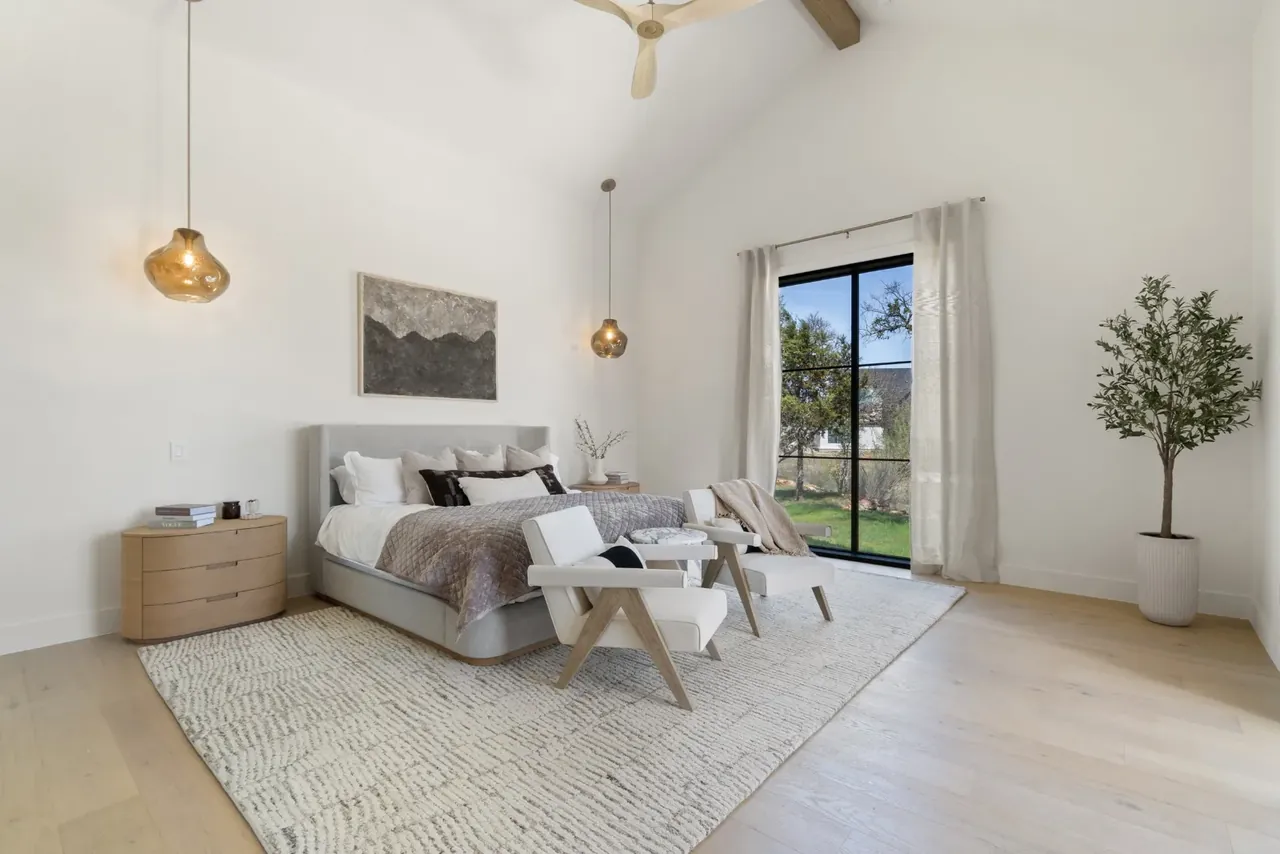 Primary bedroom with doors to the yard